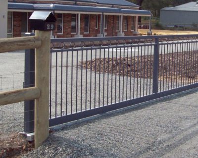 Sliding gate, Moora style, powder coated with post & rail fence