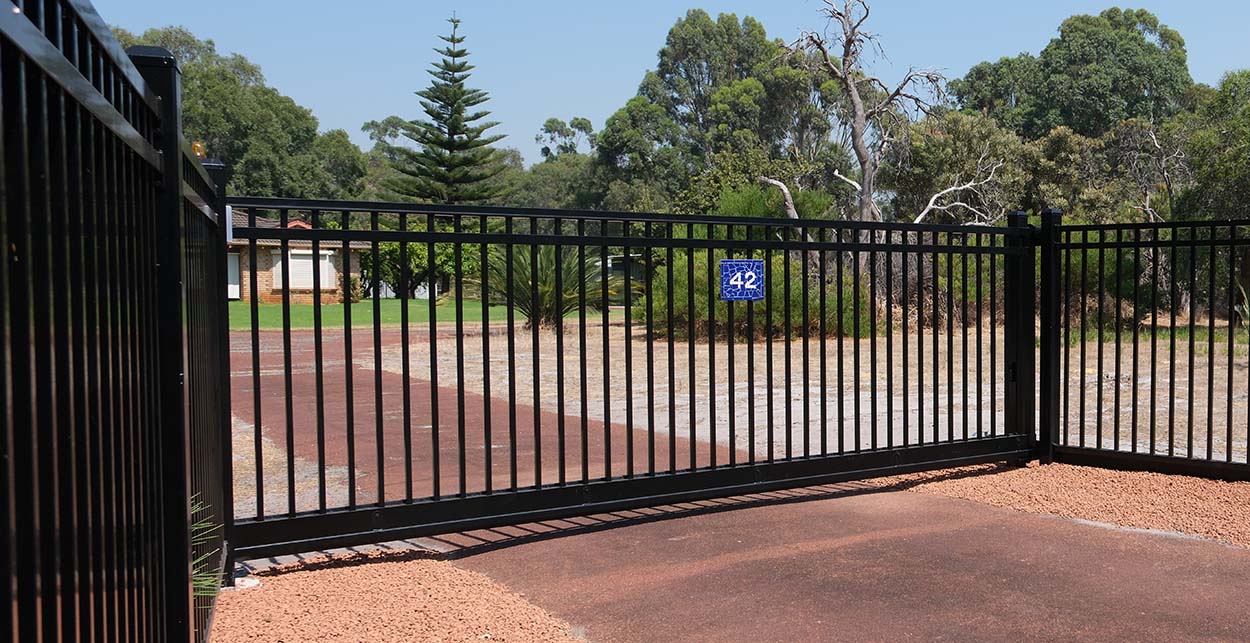 Black automatic sliding gate installed in Perth by Gate Master Australia at residential driveway